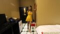 Standing in bedroom wearing yellow sundress