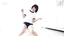 Sitting on ball in gym class outfit arms raised short hair