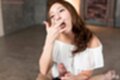 Licking cum from her fingers holding spent cock