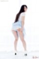 Kawagoe yui leaning forward looking over her shoulder long hair down her back upskirt panties wearing high heels