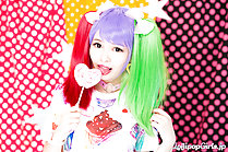 Atomi Shuri licking lollipop playing with her hair